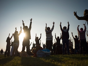 Revellers perform yoga as they celebrate the summer solstice on Salisbury Plain in southern England